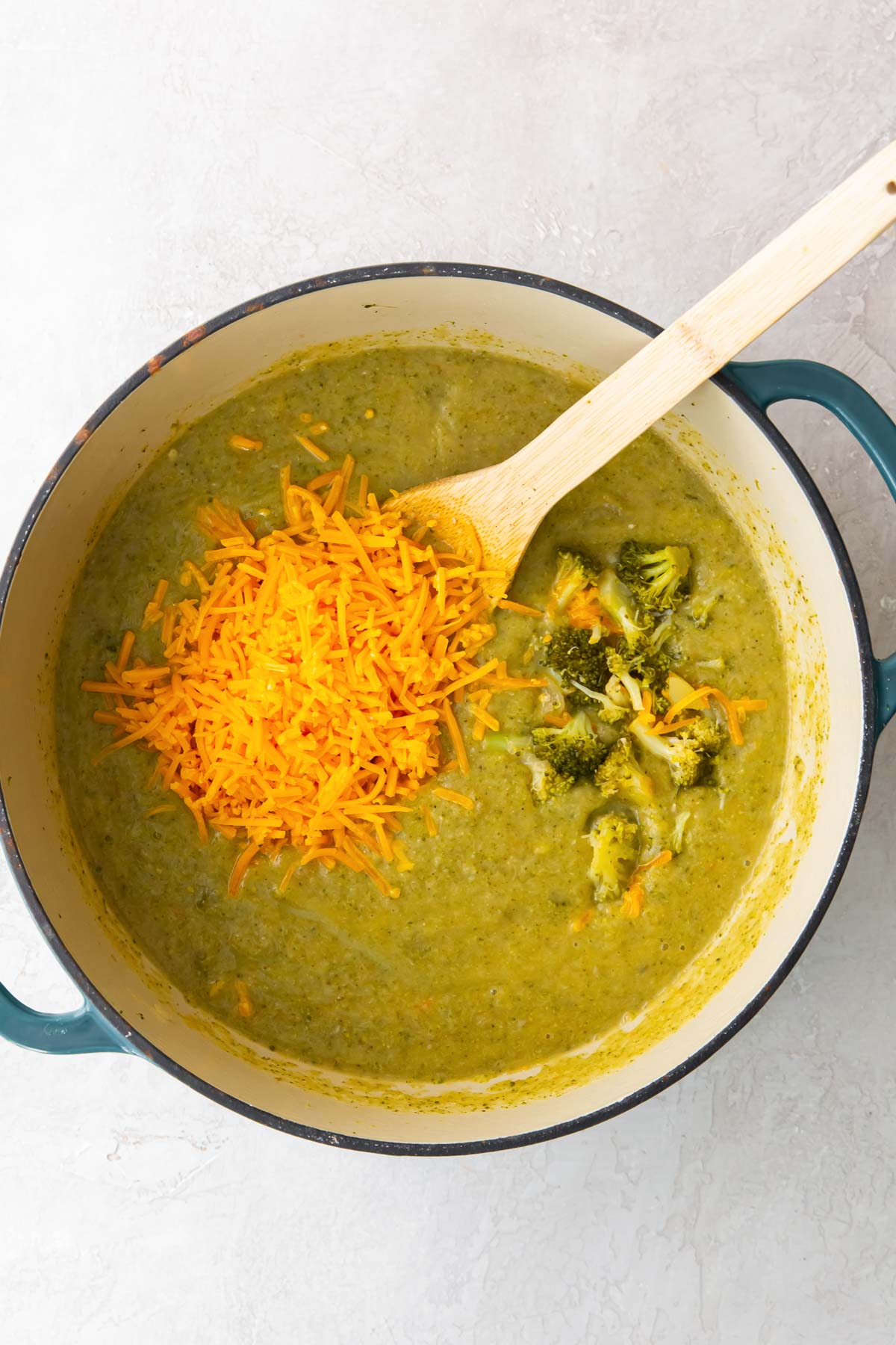 This homemade Broccoli Cheddar Soup is creamy, healthy and so easy to make! You'll love this comfort food soup recipe! Shredded cheddar and broccoli pieces added to soup.